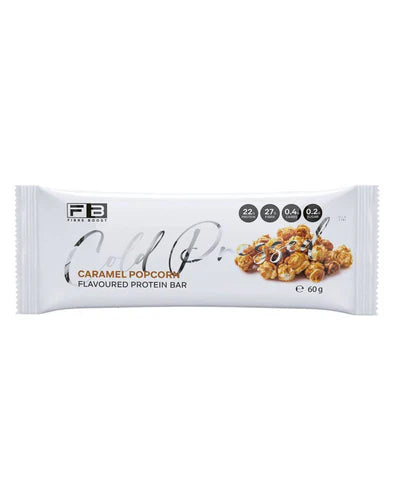 Fibre Boost Protein Bar with caramel popcorn flavor, cold-pressed, showing the bar's texture and caramel popcorn pieces.