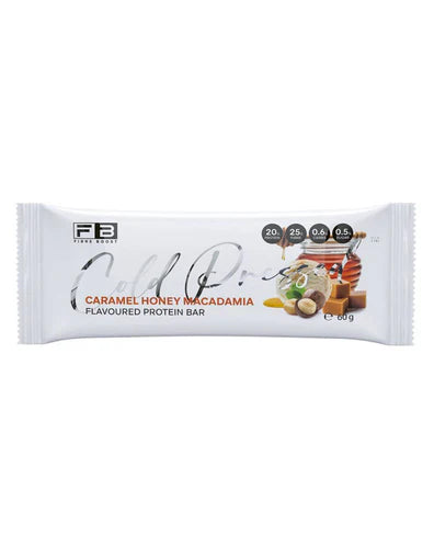 Fibre Boost Protein Bar with caramel, honey, and macadamia, featuring a cold-pressed, textured appearance and golden-brown toppings.