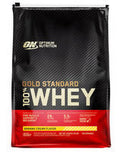 Optimum Nutrition 100% Gold Standard Whey protein powder container with label, scoop, and packaging visible.