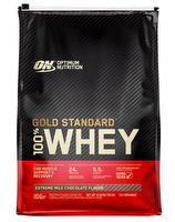 OPTIMUM NUTRITION 100% Gold Standard Whey protein powder container with label and scoop in front.