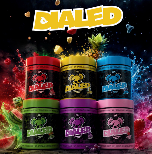 Dialed Pre Workout supplement from The X Athletics, showing a container with vibrant label design and scoop of powder inside.