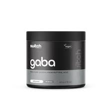 Switch Nutrition GABA supplement bottle with label visible, featuring white and green branding and product details.