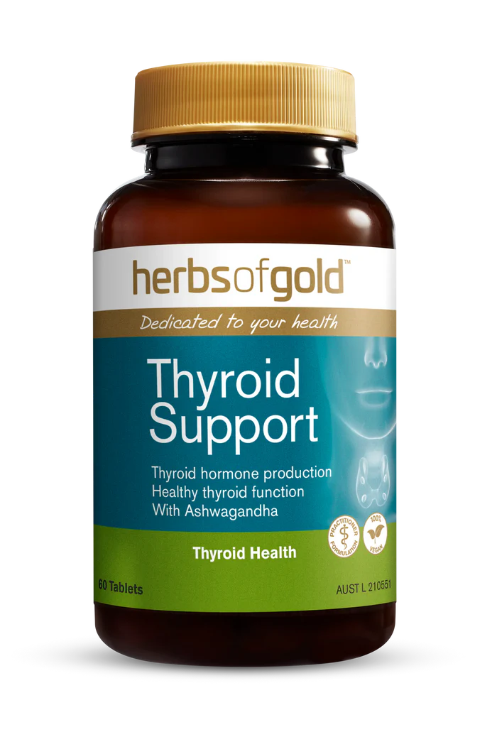 Herbs of Gold Thyroid Support supplement bottle with herbal capsules and label showing thyroid health benefits.