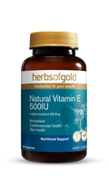 Herbs of Gold Natural Vitamin E 500IU supplement bottle with label showing product details and branding.
