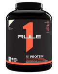 Container of RULE 1 PROTEIN ISOLATE powder with a label featuring the RULE1 brand logo and product details.