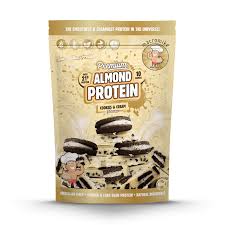Macro Mike Almond Protein container with label and scoop, showcasing the MACRO MIKE brand and almond-flavored protein powder.