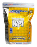 International Protein Amino Charged WPI banana ice cream flavored protein powder in 907g container with scoop and label.